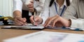 businesswoman hand hold pen and point at document to brainstorm about static Royalty Free Stock Photo