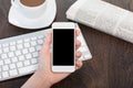 Businesswoman hand holding a phone with against the background o Royalty Free Stock Photo