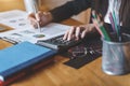 Businesswoman hand pressing on calculator for calculating cost estimating Royalty Free Stock Photo