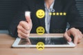 Businesswoman hand pressing smiley face emoticon on virtual touch screen Royalty Free Stock Photo