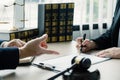 Businesswoman hand sign after Lawyer providing legal consult dispute service at the office with justice scale and gavel hammer Royalty Free Stock Photo