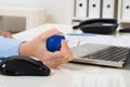 Businesswoman hand squeezing stress ball