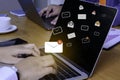 Businesswoman hand using laptop on table in office with new email alert sign icon pop-up. Mail communication message technology Royalty Free Stock Photo