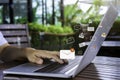 Businesswoman hand using laptop on table in office with new email alert sign icon pop-up. Mail communication message technology Royalty Free Stock Photo