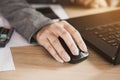 Businesswoman hand using mouse working on computer Royalty Free Stock Photo