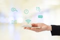 Businesswoman hand using smart-phone with internet of things icon on blurred background, business and technology concept Royalty Free Stock Photo