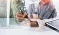 Businesswoman hand working with laptop computer, tablet and smart phone in modern office with virtual icon diagram at modernoffice Royalty Free Stock Photo