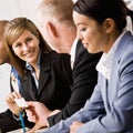 Businesswoman handing co-worker business card Royalty Free Stock Photo