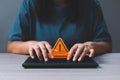 Businesswoman hands on computer keyboard got warning sign icon with virtual screen. Warning or alert software Royalty Free Stock Photo