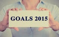Businesswoman hands holding sign with goals 2015 text message