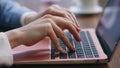 Businesswoman hands pressing laptop keyboard at office close up. Woman typing Royalty Free Stock Photo