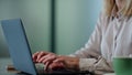 Businesswoman hands typing laptop keyboard close up. Woman working computer