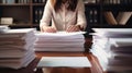 Businesswoman hands working in Stacks of paper files for searching and checking unfinished documents achieves on folders papers at