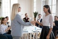 Businesswoman handshake greeting female colleague at meeting Royalty Free Stock Photo