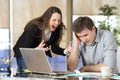 Businesswoman harassing an intern at office Royalty Free Stock Photo