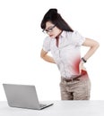 Businesswoman having back pain while working Royalty Free Stock Photo