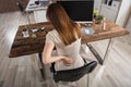 Businesswoman Having Back Pain At Workplace