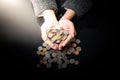 Businesswoman is having hands full of coins Royalty Free Stock Photo