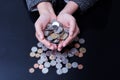 Businesswoman is having hands full of coins Royalty Free Stock Photo