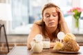 Businesswoman having sensitivity to dairy and pastry products Royalty Free Stock Photo