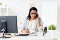 Businesswoman with headset and notebook at office Royalty Free Stock Photo