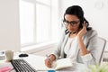 Businesswoman with headset talking at office Royalty Free Stock Photo