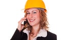 Businesswoman with helmet and phone Royalty Free Stock Photo