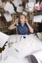 Businesswoman in her office and flying paper sheet