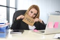 Businesswoman in her 40s holding help sign desparate suffering stress overworked