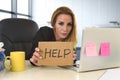 Businesswoman in her 40s holding help sign desparate suffering stress overworked