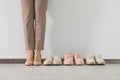 Businesswoman in high heel shoes near comfortable sneakers indoors, closeup Royalty Free Stock Photo