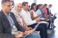 Businesswoman in hijab looking at camera in a business seminar Royalty Free Stock Photo