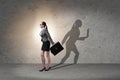 The businesswoman and his shadow in business concept Royalty Free Stock Photo