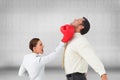 Businesswoman hitting a businessman with boxing gloves Royalty Free Stock Photo