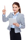 Businesswoman hold digital tablet and finger point up Royalty Free Stock Photo