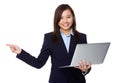 Businesswoman hold with laptop computer and finger point aside Royalty Free Stock Photo