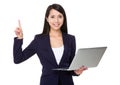 Businesswoman hold with laptop and finger point upwards Royalty Free Stock Photo