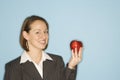 Businesswoman holding apple. Royalty Free Stock Photo