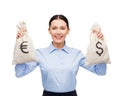 Businesswoman holding bags with dollar and euro Royalty Free Stock Photo