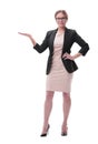 Businesswoman holding blank copy space on her open palm standing in full length Royalty Free Stock Photo