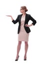 Businesswoman holding blank copy space on her open palm standing in full length Royalty Free Stock Photo