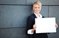 Businesswoman holding blank white sign Royalty Free Stock Photo