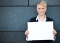 Businesswoman holding blank white sign Royalty Free Stock Photo