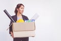 Businesswoman holding box leaving office after quitting job Royalty Free Stock Photo