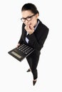 Businesswoman holding a calculator. Conceptual image