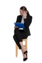 Businesswoman holding clipboard and making a mad sign Royalty Free Stock Photo