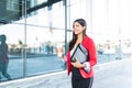 Businesswoman Holding Coffee Cup And Folder Outside Work Royalty Free Stock Photo