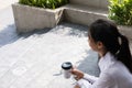 Businesswoman holding coffee outside office building. beautiful Royalty Free Stock Photo