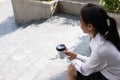 Businesswoman holding coffee outside office building. beautiful Royalty Free Stock Photo