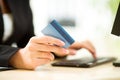 Businesswoman holding credit card on laptop for online payment concept